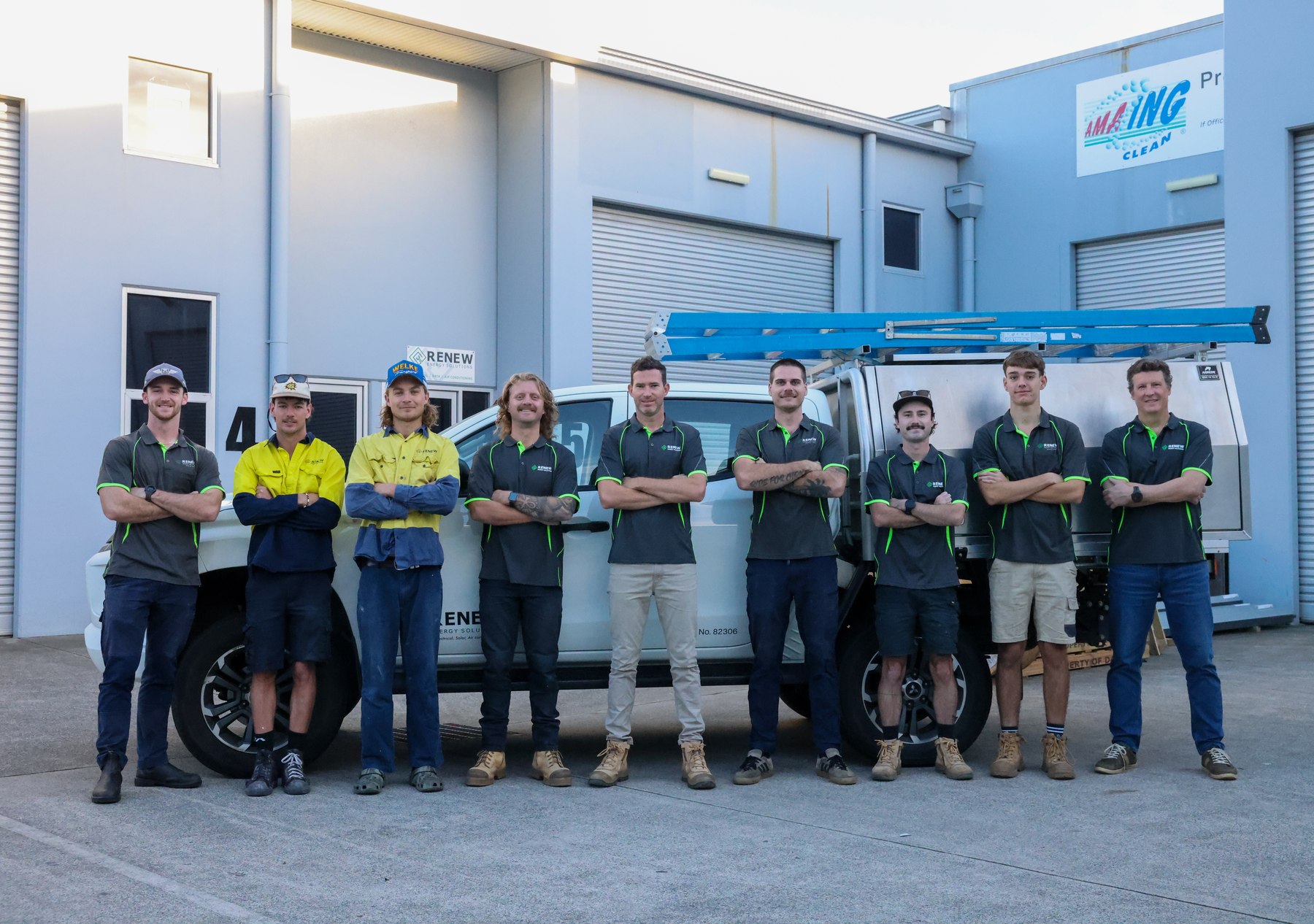 The Renew Energy Solutions team with their service vehicles