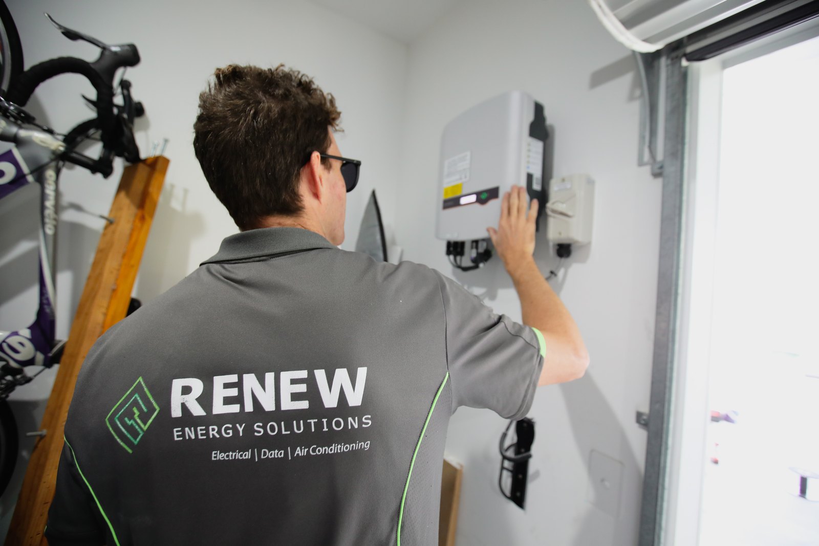 Renew Energy technician installing home energy equipment